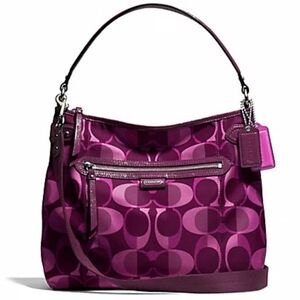 Coach Daisy Signature hobo shoulder purse in purple and brown.